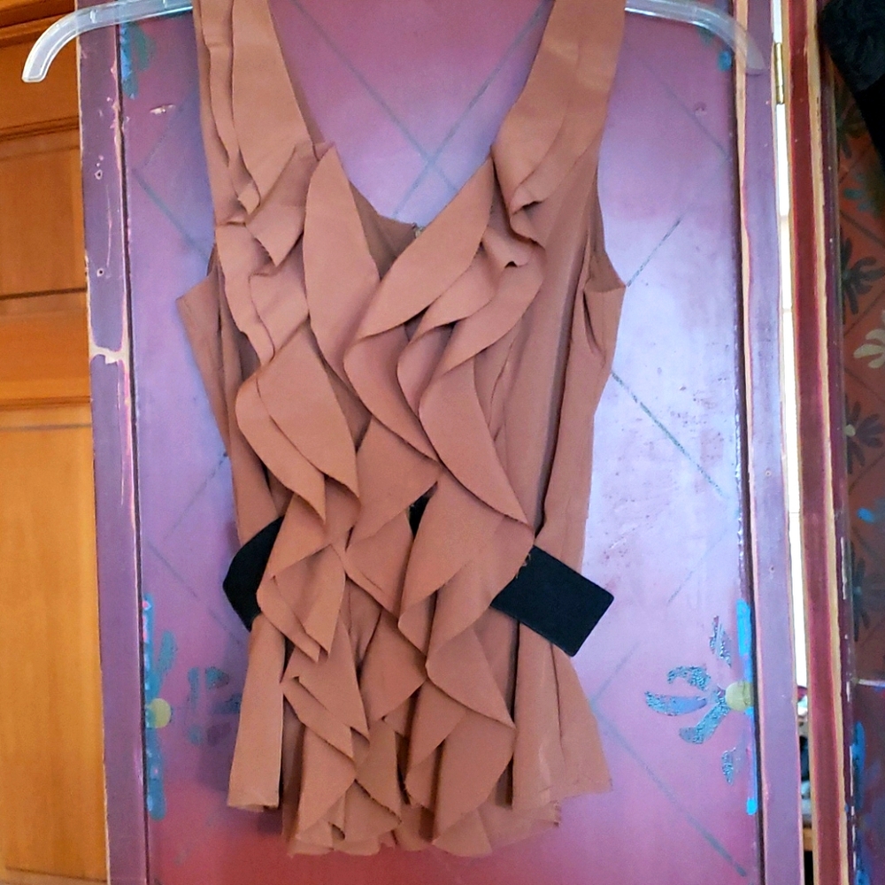 Sleeveless silk blouse with fluffy ruffles